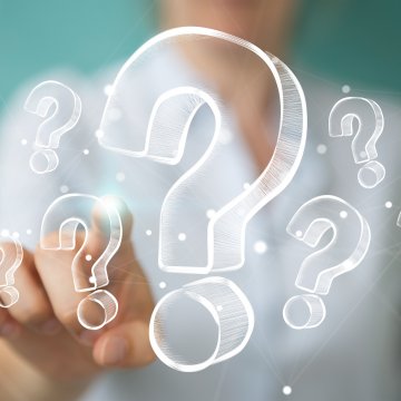 restoro system optimizers woman in white shirt touching question mark signs